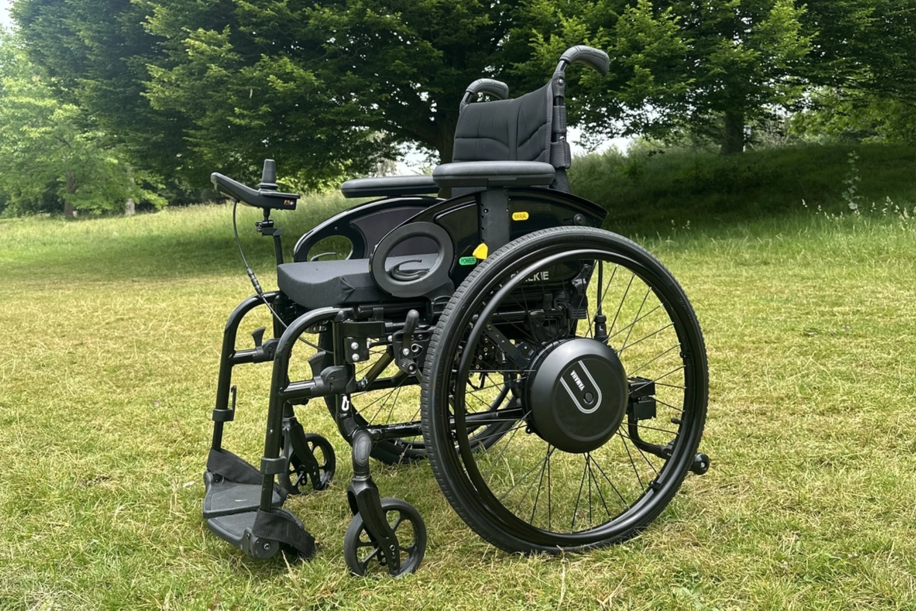SD Motion Drive fitted to a manual wheelchair on grass