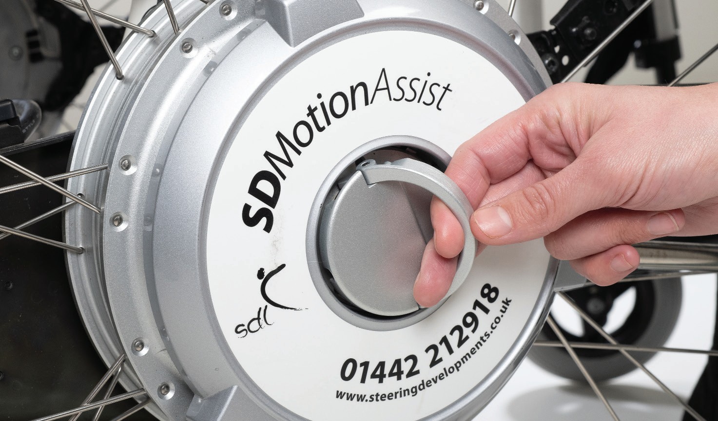 Close-up of the assist mode switch on the wheel