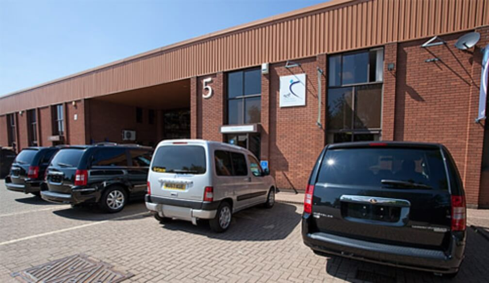 Steering Developments unit 5 premises with adapted vehicles outside